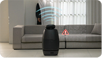 A robot is on the floor in front of a couch.

Description generated by AI